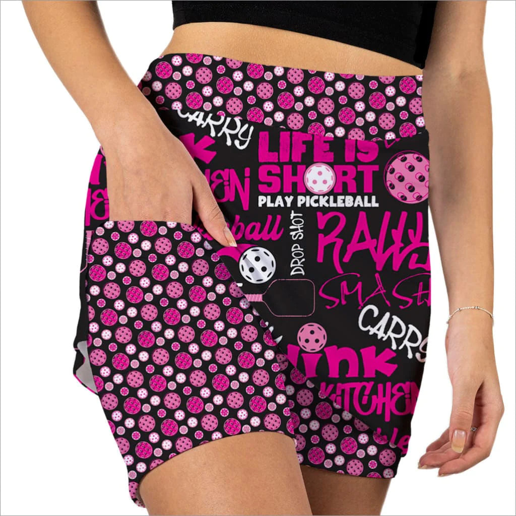 Front image of Skort Obsession pickleball slam pink skort. Pull on black and pink skort. 