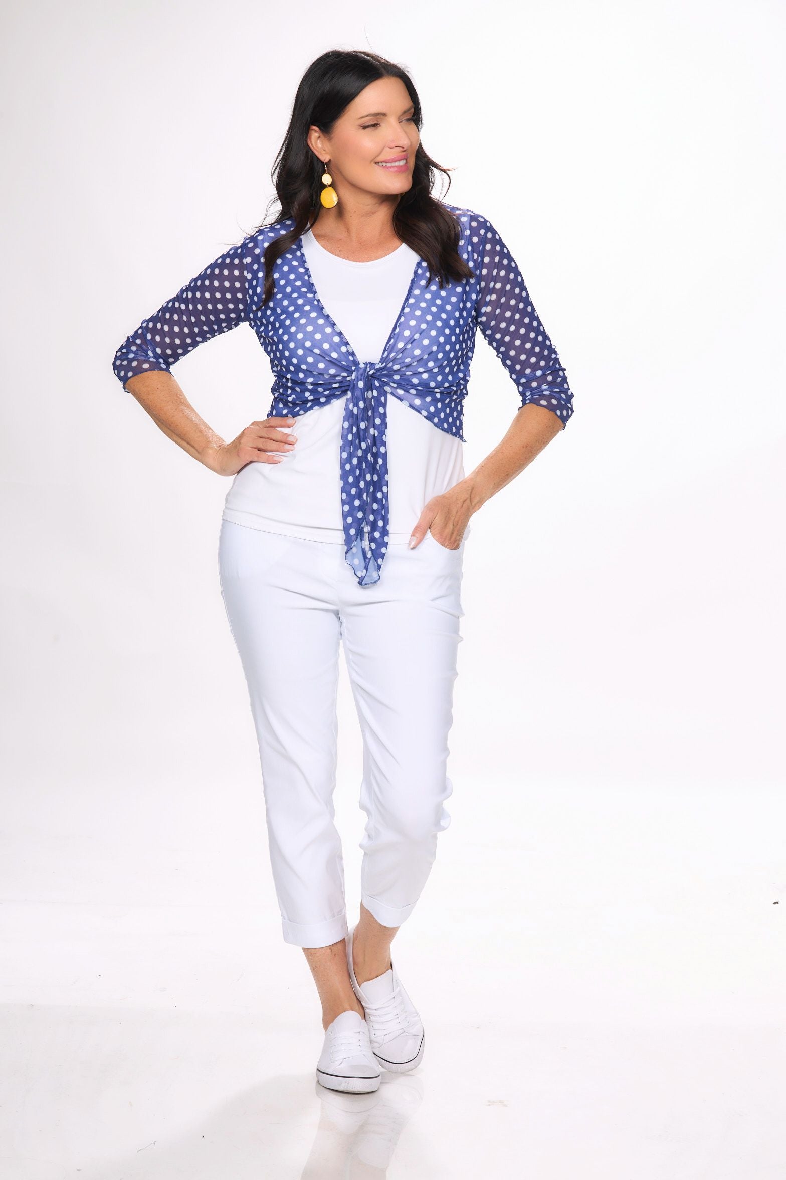 Front image of navy and white polka dot sheer shawl.