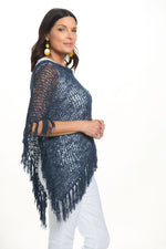 Side image of lost river navy popcorn poncho with fringe. 