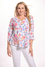 Front image of floral printed one pocket top. Cubism printed top. 