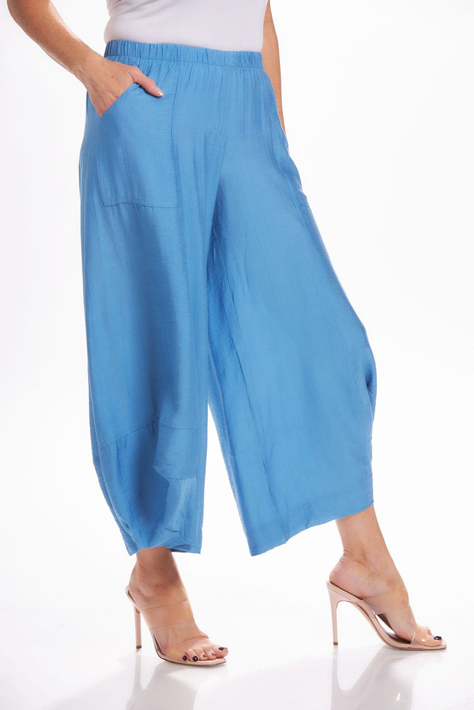 Side image of Shana crushed lantern pant. Blue pull on pants with pockets. 