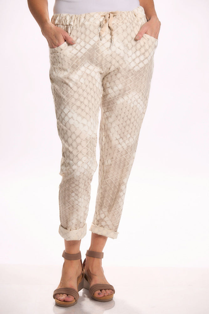 Front image of Catherine Lily white pull on pants. Beige printed bottoms.