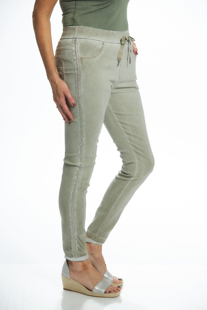 Side image of taupe pull on embroidered side jeggings. Made in italy bottoms. 