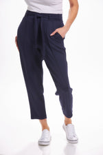 Front image of Nanette pintuck waist tie pants. Navy solid pants. 