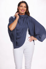 Front image of blue pull through wrap top. 