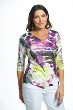 Front image of impulse purple printed top. Faux wrap top with sequins. 