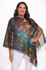Front image of art design wrap in red denim print. Shawl with fringe. 