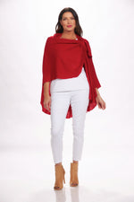 Front image of magic scarf loop and pull through wrap. Red drapey cardigan. 