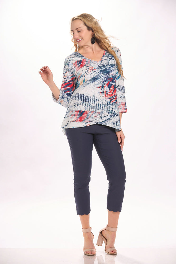 Front image of parsley and sage crossover hem top. Navy and blue printed top. 