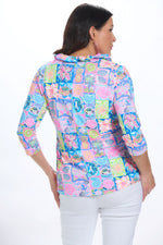 Back image of lulu b ruffle neckline top in moma multi print. 