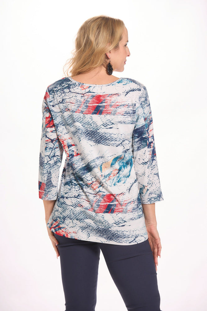 Back image of parsley and sage crossover hem top. Navy and blue printed top. 