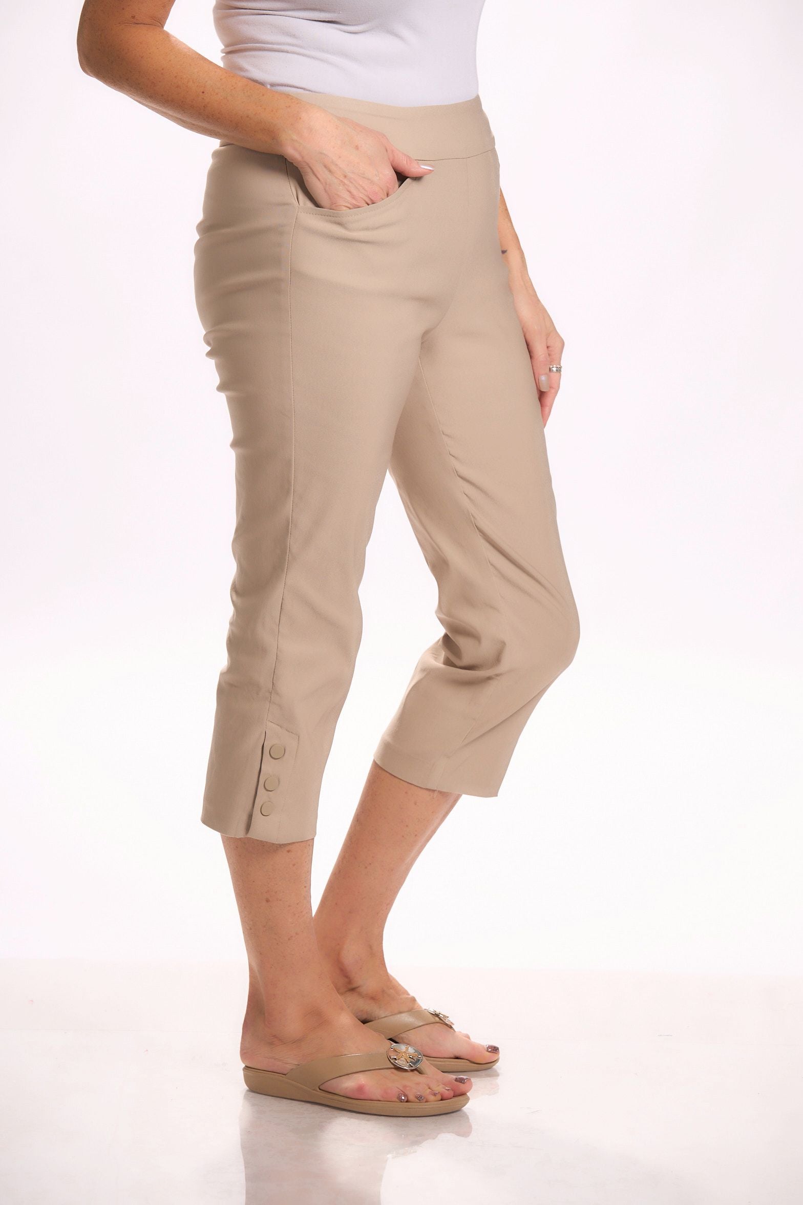 Side image of Tribal sahara tan snap capri bottoms. 