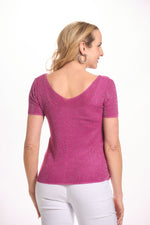 Back image of look mode shimmer sweater. Short sleeve pink top. 