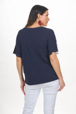 Back image of Nallie & Millie short sleeve striped tee shirt. 
