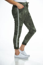 Side image of look mode pull on printed pants. Stud side made in italy bottoms. 