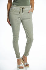 Front image of taupe pull on embroidered side jeggings. Made in italy bottoms. 