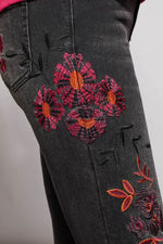 Side detail image of Tribal Audrey Embroidered Slim Leg Jean. Dusty black floral printed denim. 