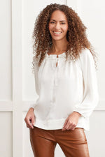 Front image of Tribal flowy satin peasant blouse. Cream long sleeve blouse. 