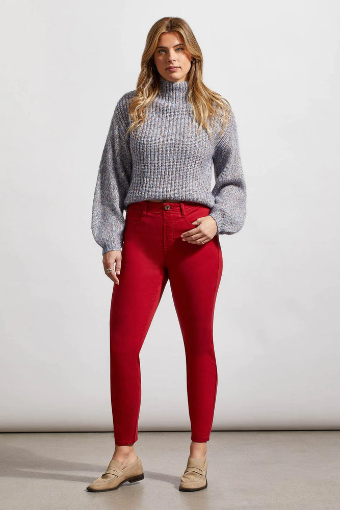 Front image of Tribal icon skinny jeans. Earth red bottoms. 