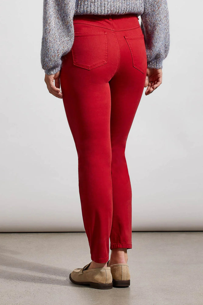 Back image of Tribal icon skinny jeans. Earth red bottoms. 