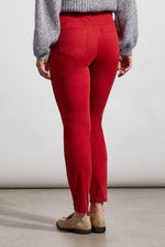Back image of Tribal icon skinny jeans. Earth red bottoms. 