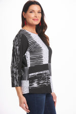 Side image of parsely & sage 3/4 sleeve top in black and white print. 