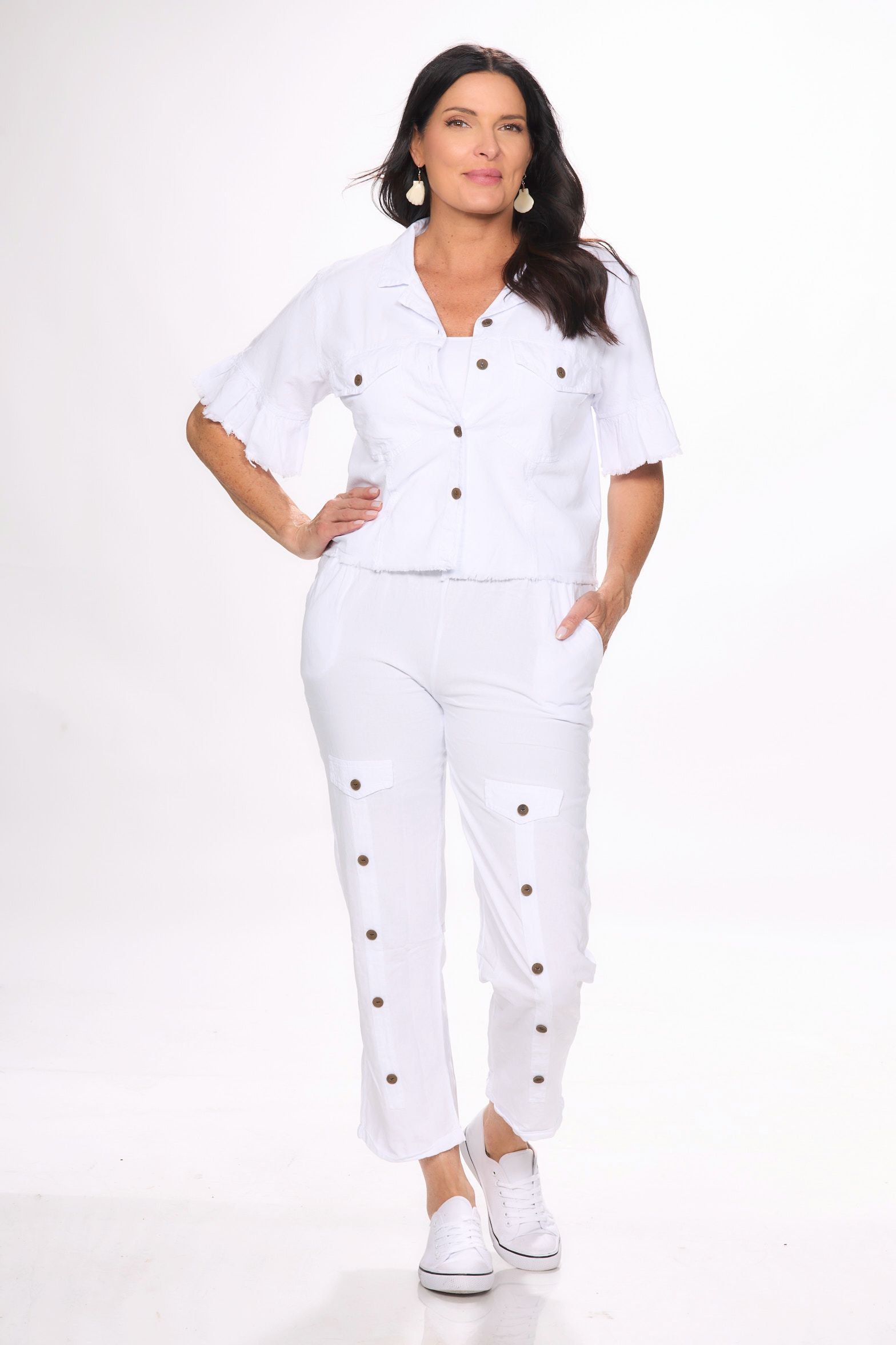 Front image of white pull on button detail pants by Giocam.