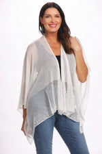 Front image of magic scarf white shawl. White lightweight knit ruana. 