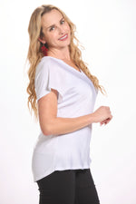 Side image of short sleeve made in italy top. White stain front top. 