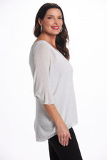 Side image of white shimmer top. Made in Italy white shimmer top. 
