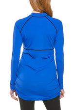 Back image of Coolibar lawai ruche swim shirt. Long sleeve baja blue swim shirt. 