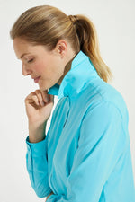 Front image of Coolibar Rhodes Shirt. Aqua blue long sleeve top. 