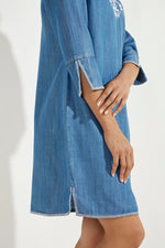 Side image of Coolibar Capistrano Tunic Dress. Chambray light blue dress. 