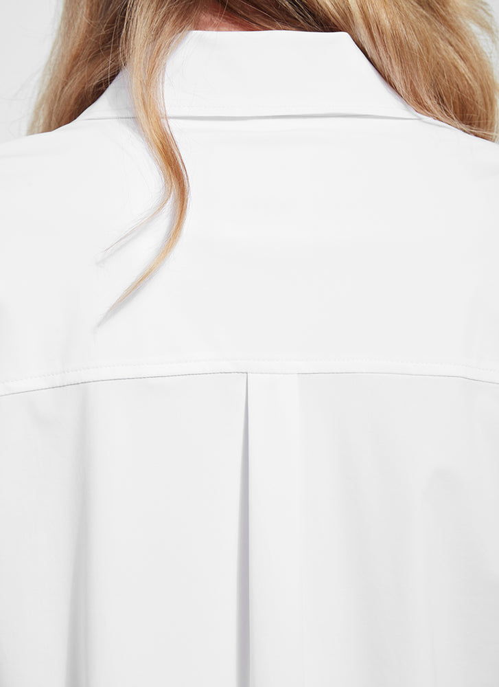 Zoomed back detail view of Lysse schiffer button down shirt. White long sleeve top. 