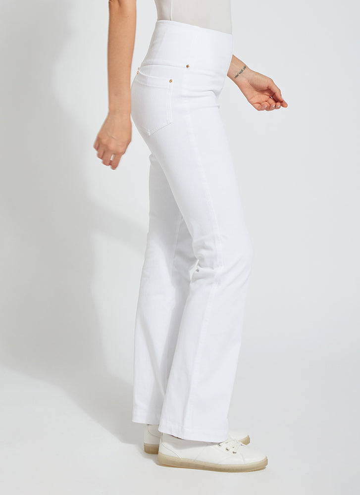 Side view of Lysse baby bootcut denim pants in white. Pull on lysse pants. 