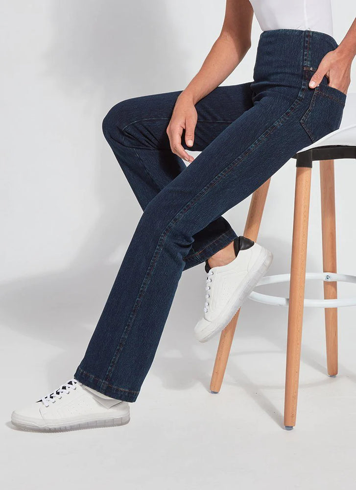 Glam Shot Image of Indigo pull on jeans with back and side pockets, on a stool, Baby Bootcut Denim