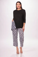 Front image of Shana round neck one pocket top. Black and white printed crinkle top. 