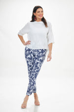 Front full outfit image of Up! techno slim pant with petal trim. Blue and white tampa print. 