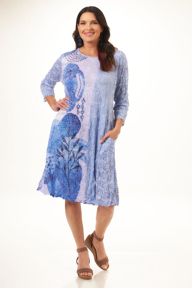 Front image of Shana blue mixed print dress. Midi length dress with pockets. 