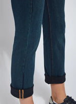 Side View Bottom Close Up Image of Indigo jeans with back pockets and cuffed leg, Boyfriend Denim