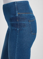 Side View Closeup Image of Mid Wash jeans with back pockets and cuffed leg, Boyfriend Denim
