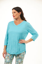 Front image of shana crinkle tee shirt in turquoise. Half sleeve v-neck crinkle top. 