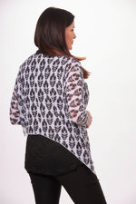 Side image of shana 3/4 sleeve mesh asymmetrical hem top. Black and white topper. 