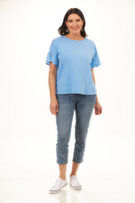 Front image of tribal frill crew neck top. Blue short sleeve top. 
