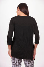 Back image of Shana round neck one pocket top. Black and white printed crinkle top. 