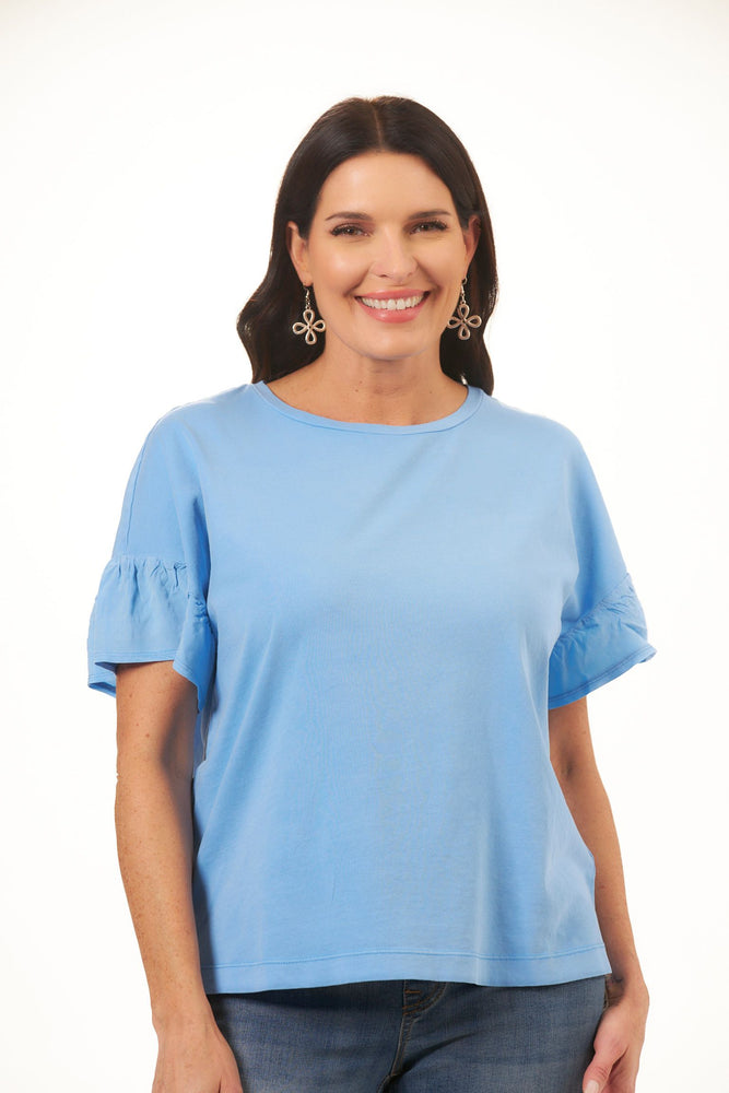 Front image of tribal frill crew neck top. Blue short sleeve top. 