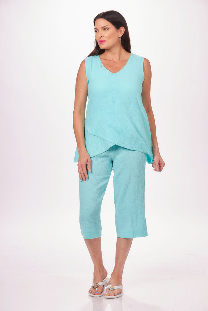 Front image of Lulu B sleeveless asymmetrical tank.  Tank top with buttons in clear seafoam. 