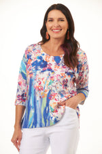 Front image of Cubism 3/4 sleeve back button top. 3/4 sleeve multi color scoop neck top. 