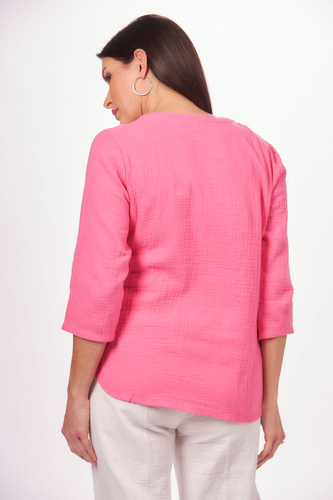 Back image of lulu b 3/4 sleeve scoop neck top. Hot pink rounded hemline top. 