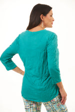 Back image of shana crinkle top. Half sleeve v-neck crinkle top in jade. 